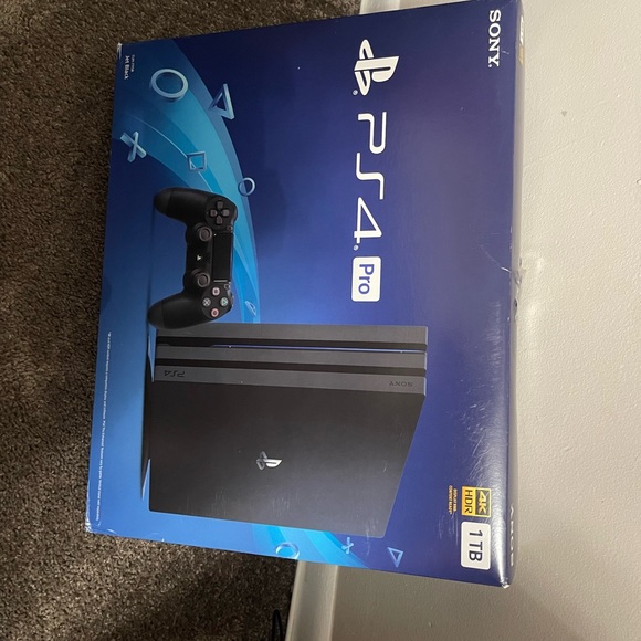 Like new barely used Play Station 4 1TB with 12 disc games included!